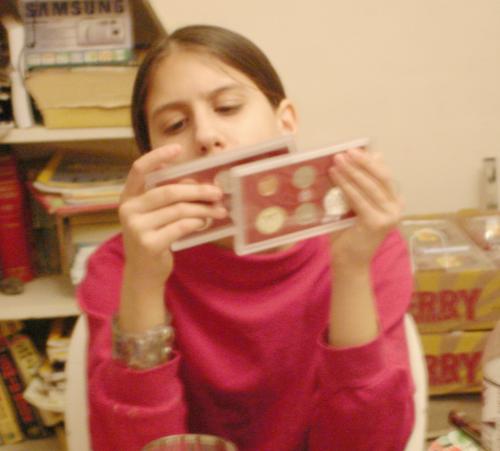 Itka Shira Safir checking out her coins